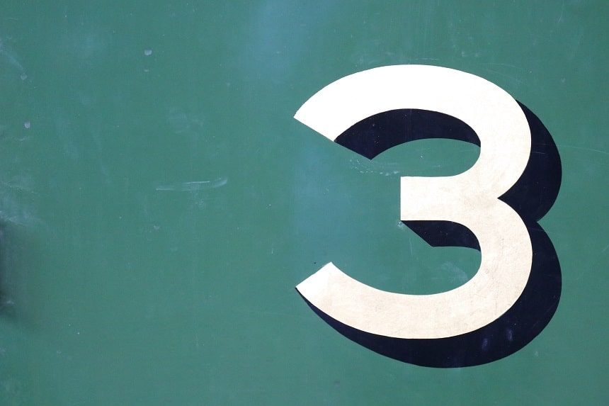 Image, white Arabic numeral 3 painted on a green background