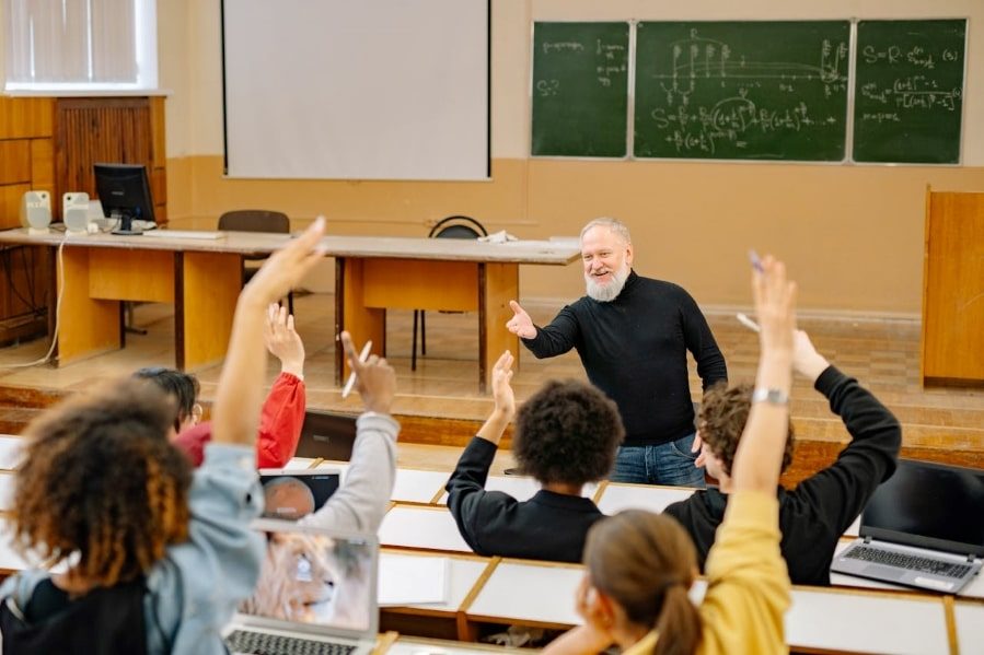 Lecturer presenting and answering class questions